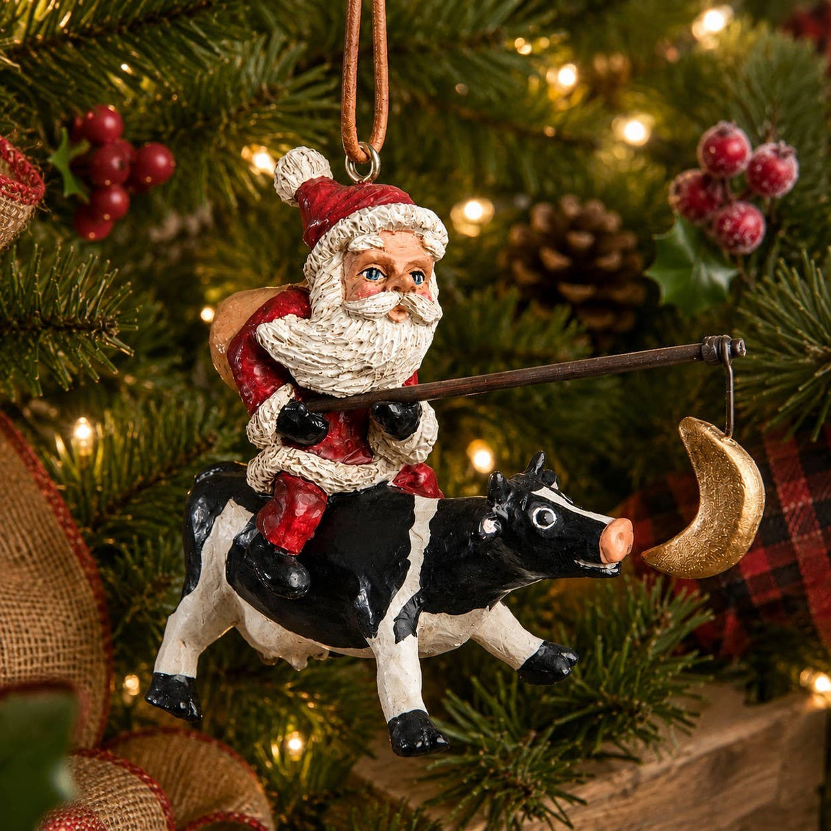 Santa Riding a Cow Ornament